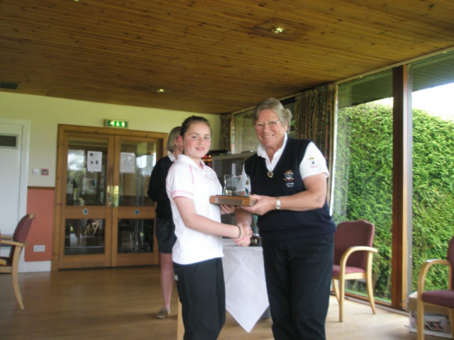 Presenting (a very young!) Emma Morrison with Junior Spring Meeting trophy. Photo courtesy of Tracy Laughland