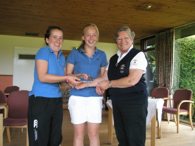 Presenting Rachael Steedman and partner with Junior Foursomes trophy. Photo courtesy of Tracy Laughland