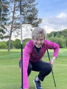 Kate collecting her ball after chipping in